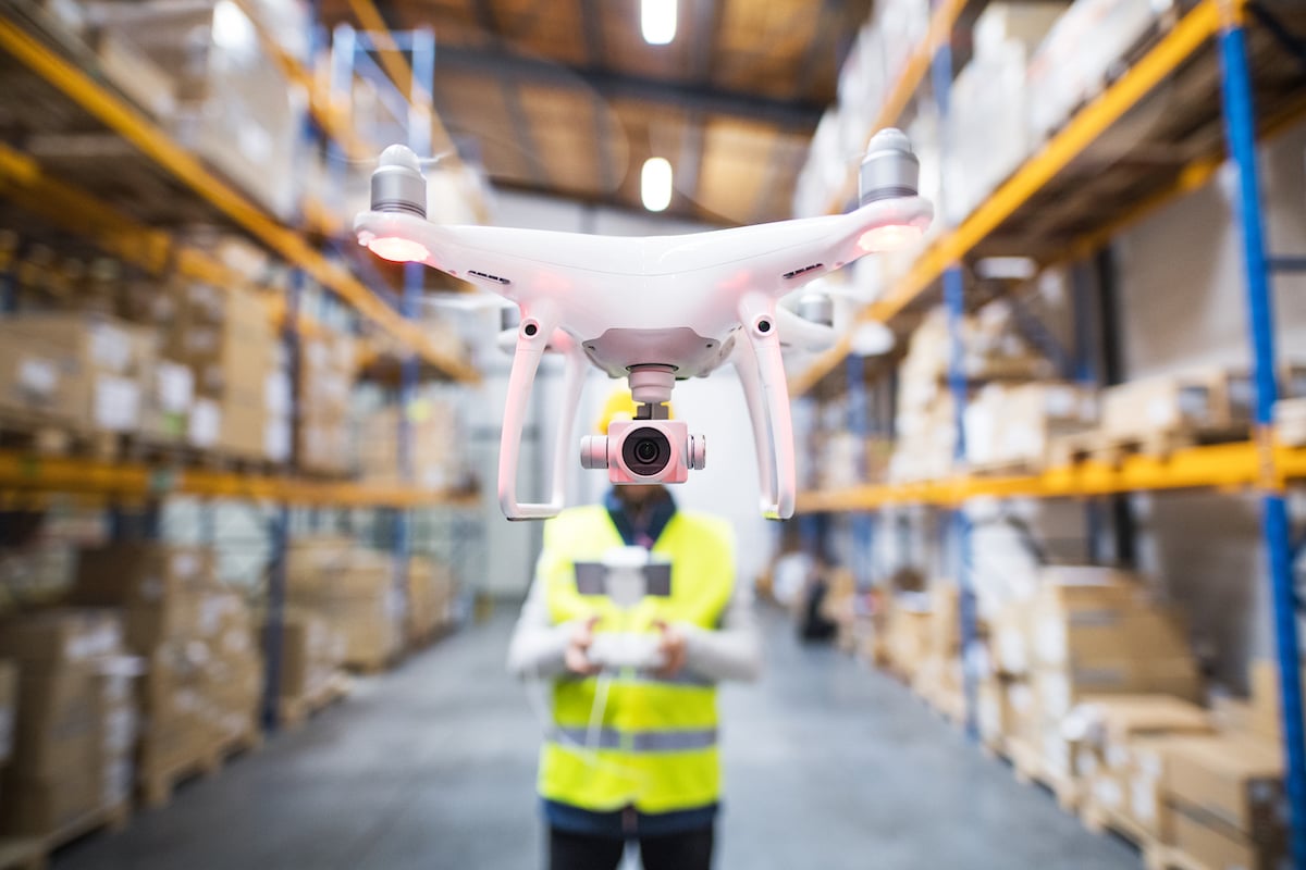 man-with-drone-in-a-warehouse-2022-02-01-23-40-45-utc